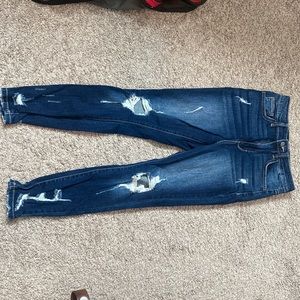 Dark wash skinny jeans with distressed legs. Size 1/25. Only worn once!!